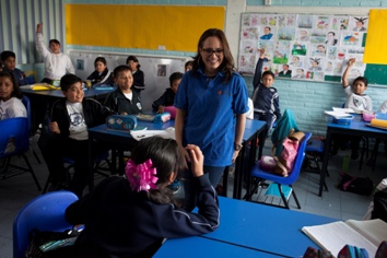 teacher and children in a classroom